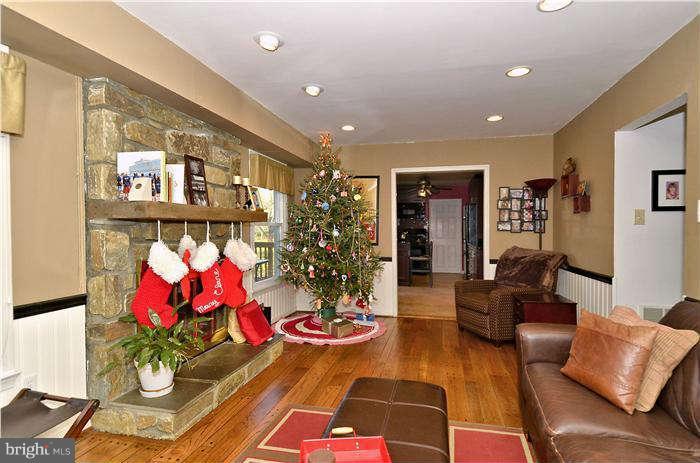 2204 Countryside Drive Silver Spring, MD 20905 - Photo 12 of 29 a living room with furniture and flowers
