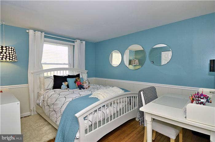 2204 Countryside Drive Silver Spring, MD 20905 - Photo 14 of 29 a bedroom with a bed and a table
