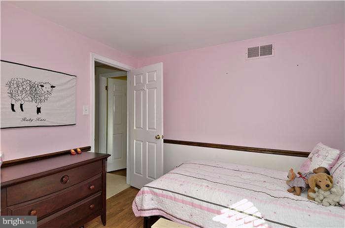 2204 Countryside Drive Silver Spring, MD 20905 - Photo 16 of 29 a bedroom with a bed and cabinets