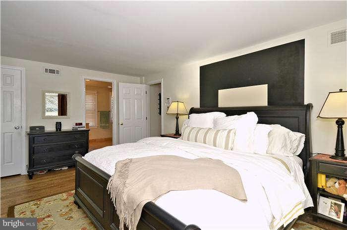 2204 Countryside Drive Silver Spring, MD 20905 - Photo 18 of 29 a bed room with a bed and a dresser