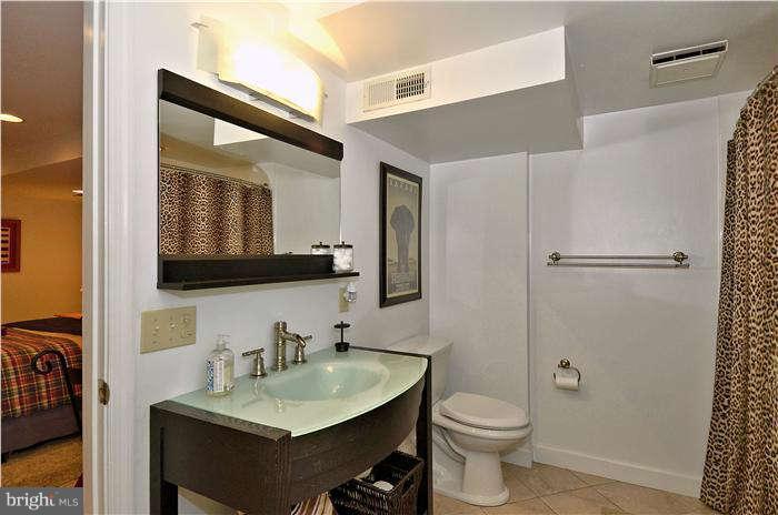 2204 Countryside Drive Silver Spring, MD 20905 - Photo 22 of 29 a bathroom with a toilet sink and mirror