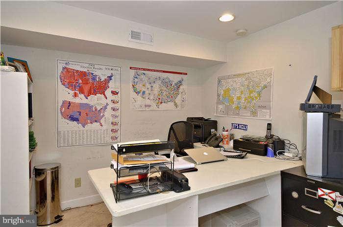 2204 Countryside Drive Silver Spring, MD 20905 - Photo 26 of 29 a work room with furniture and a flat screen tv