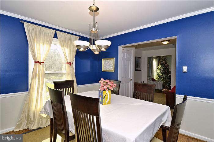 2204 Countryside Drive Silver Spring, MD 20905 - Photo 7 of 29 a view of a dining room with furniture and chandelier