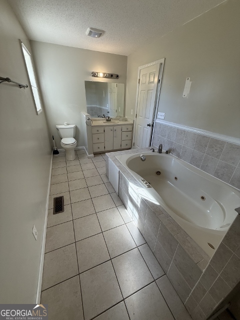 451 Lambs Bridge Road Swainsboro, GA 30401 - Photo 12 of 23 a bathroom with a tub a sink and a mirror