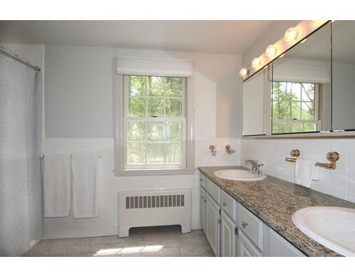 30 Decatur Lane Wayland, MA 01778 - Photo 17 of 29 a bathroom with a granite countertop sink and mirror with window