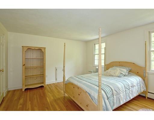 30 Decatur Lane Wayland, MA 01778 - Photo 18 of 29 a bedroom with a bed and a view of closet