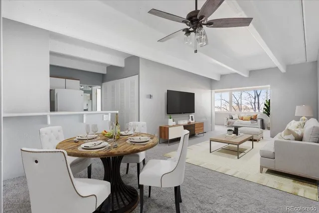 a view of a livingroom with furniture and a flat screen tv