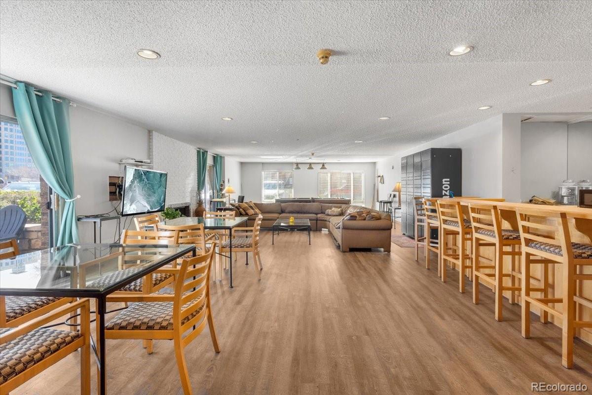 1888 South Jackson Street, Unit 604 Denver, CO 80210 - Photo 28 of 30 a living room with furniture a flat screen tv and a wooden floor