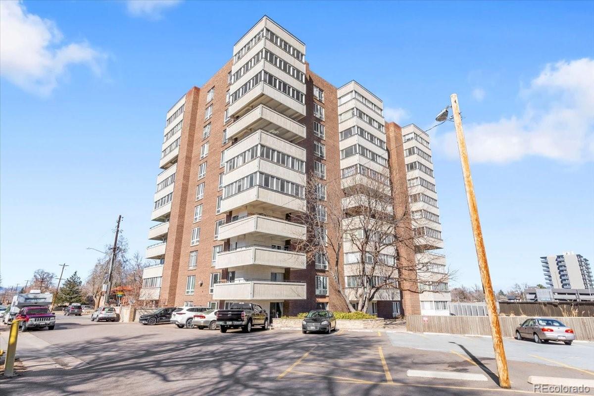 1888 South Jackson Street, Unit 604 Denver, CO 80210 - Photo 7 of 30 a view of a tall building next to a road