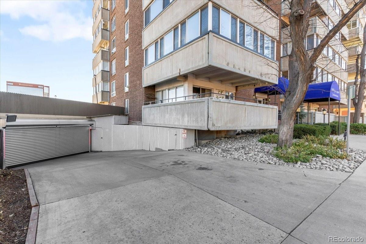 1888 South Jackson Street, Unit 604 Denver, CO 80210 - Photo 8 of 30 a view of a white building with a large tree