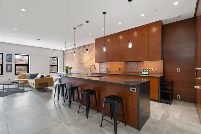 a large kitchen with a large counter top space