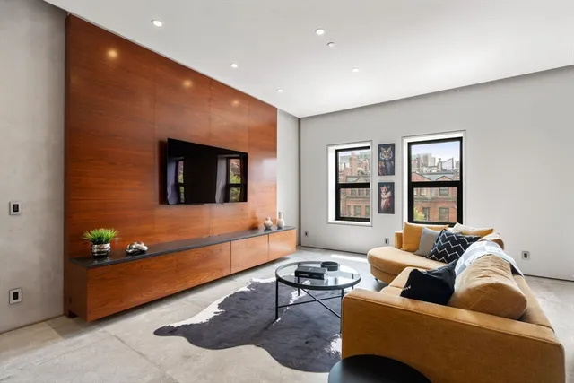 a living room with furniture and window
