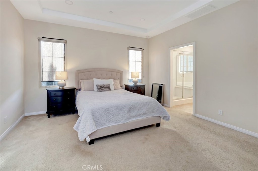 67 Hanging Garden Irvine, CA 92620 - Photo 11 of 23 a bedroom with a bed and window