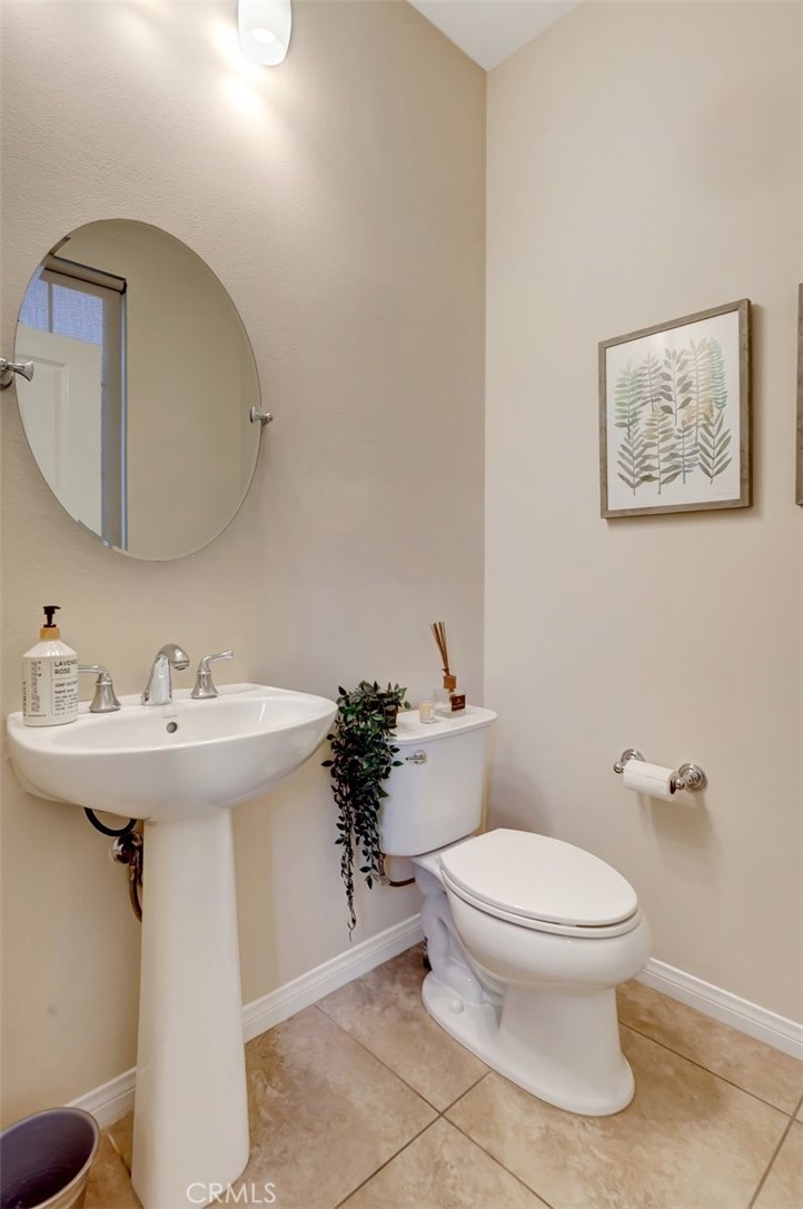 67 Hanging Garden Irvine, CA 92620 - Photo 18 of 23 a bathroom with a sink toilet and mirror
