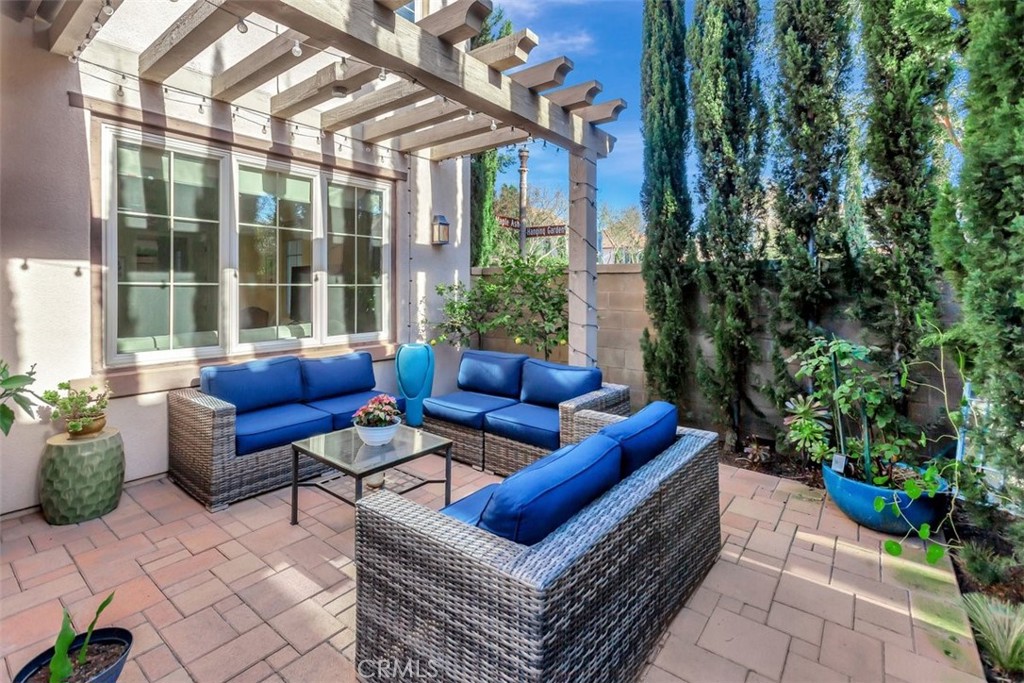 67 Hanging Garden Irvine, CA 92620 - Photo 21 of 23 a building outdoor space with patio furniture and potted plants