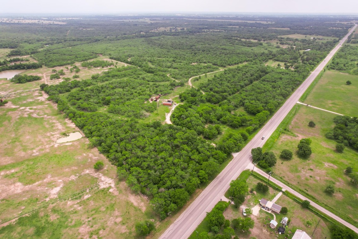 0 San Marcos Highway Luling, TX 78648 - Photo 11 of 35 a view of a lush green forest with trees and houses