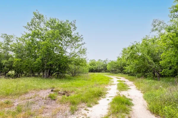 a view of a lake with a yard