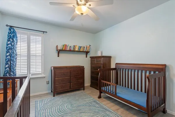 a bedroom with a bed and a cabinets