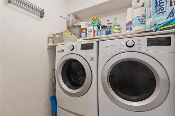 a utility room with dryer and washer