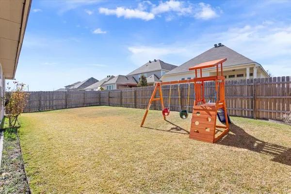 a view of a house with swimming pool and sitting area