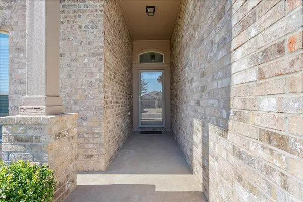 a view of a brick house with a street