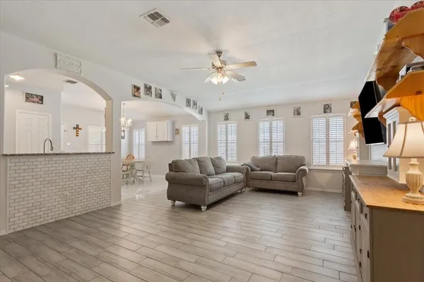 a living room with furniture and a large window