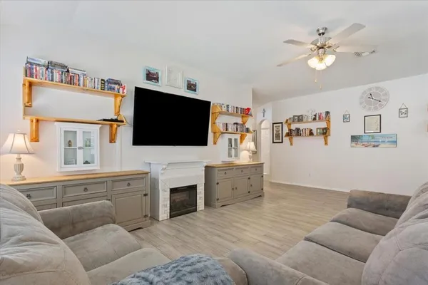 a living room with furniture and a flat screen tv