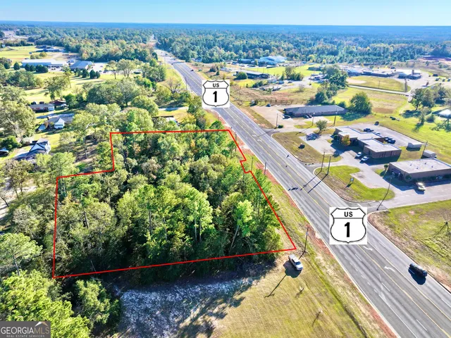 an aerial view of a house with a swimming pool