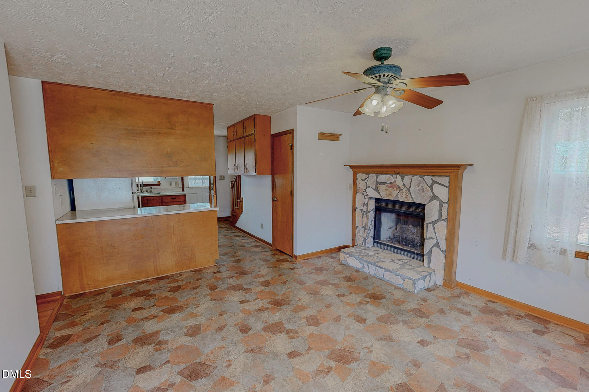 460 Medford Oakley Road Rougemont, NC 27572 - Photo 11 of 36 a view of livingroom with hardwood floor and a ceiling fan