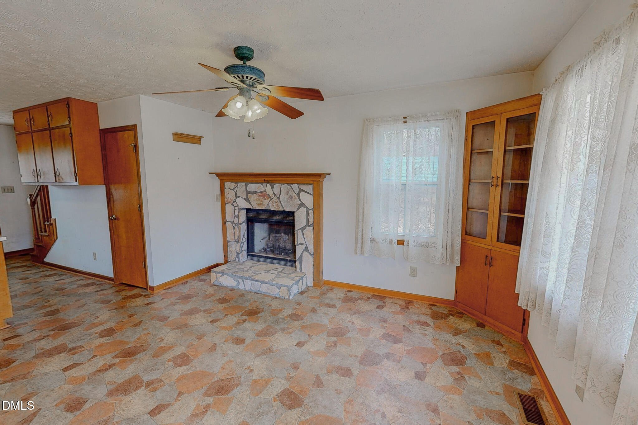 460 Medford Oakley Road Rougemont, NC 27572 - Photo 12 of 36 an empty room with windows and a fireplace