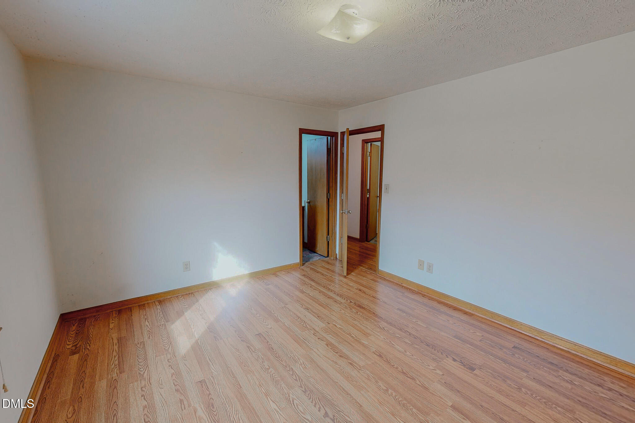460 Medford Oakley Road Rougemont, NC 27572 - Photo 17 of 36 a view of an empty room with wooden floor