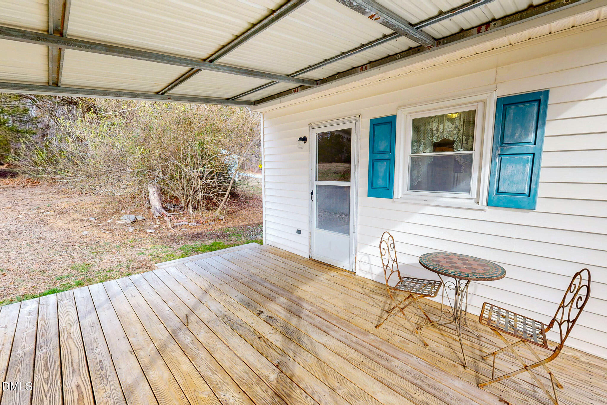 460 Medford Oakley Road Rougemont, NC 27572 - Photo 2 of 36 a view of a backyard with table and chairs and wooden floor
