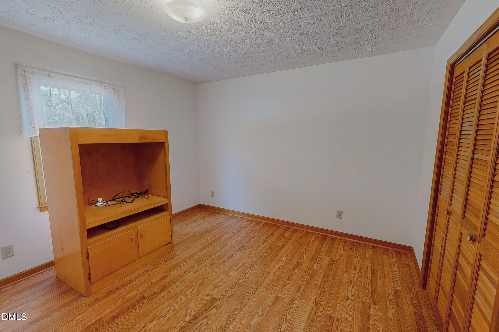 460 Medford Oakley Road Rougemont, NC 27572 - Photo 22 of 36 a view of an empty room and wooden floor