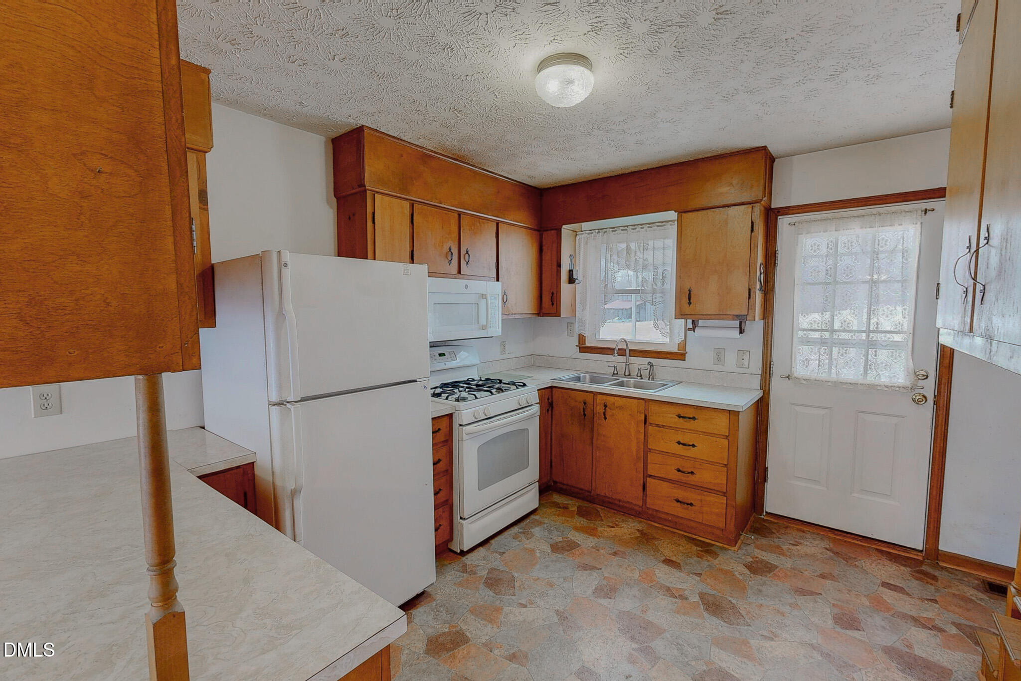 460 Medford Oakley Road Rougemont, NC 27572 - Photo 4 of 36 a kitchen with appliances a sink and a cabinets
