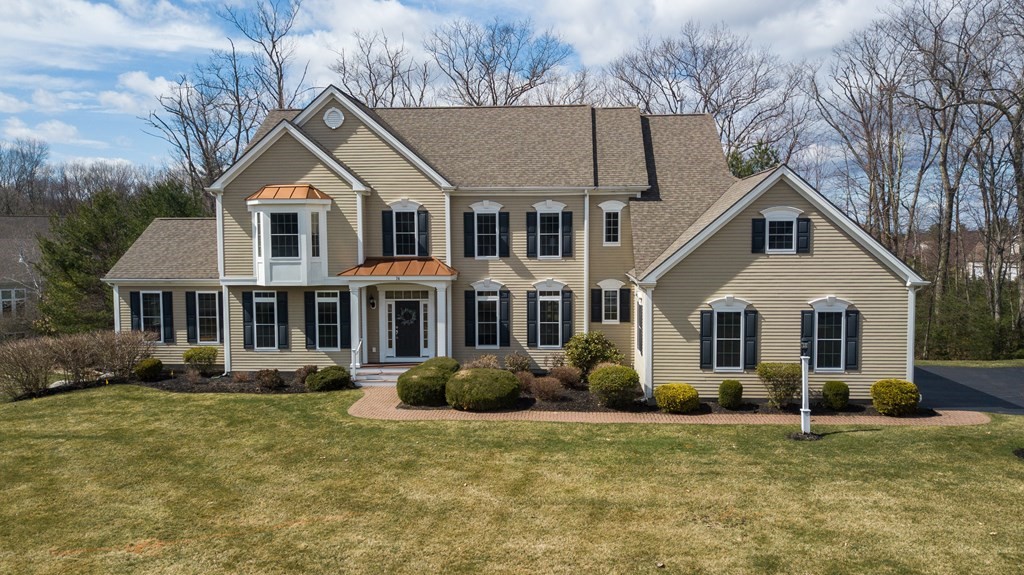 a front view of a house with a yard