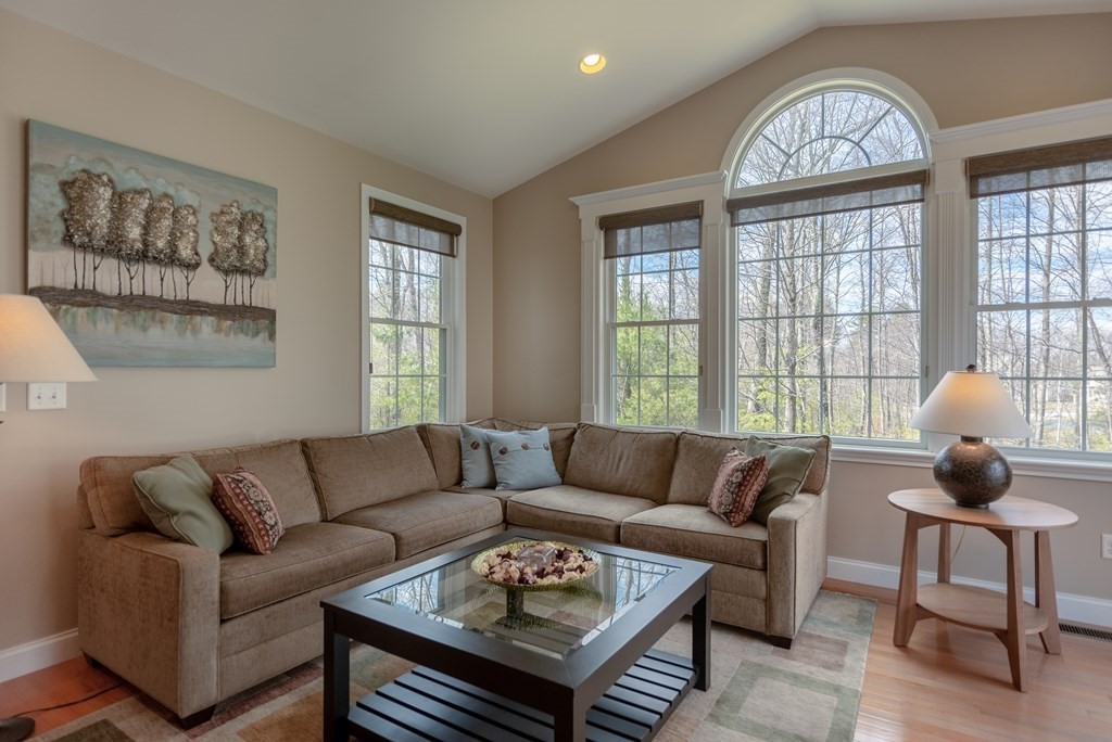 74 Canterbury Hill Road Acton, MA 01720 - Photo 13 of 37 a living room with furniture a table and a large window