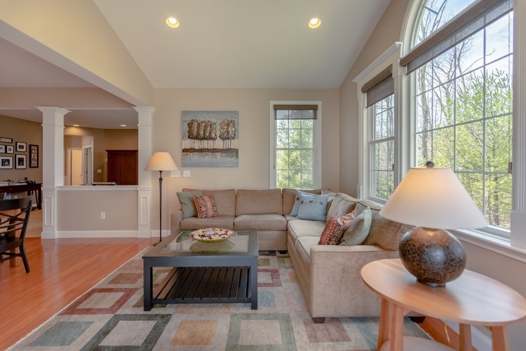 74 Canterbury Hill Road Acton, MA 01720 - Photo 14 of 37 a living room with furniture a table and a large window