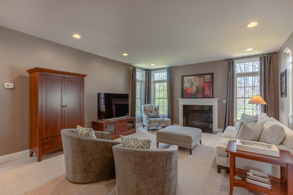 74 Canterbury Hill Road Acton, MA 01720 - Photo 15 of 37 a living room with furniture and a fireplace