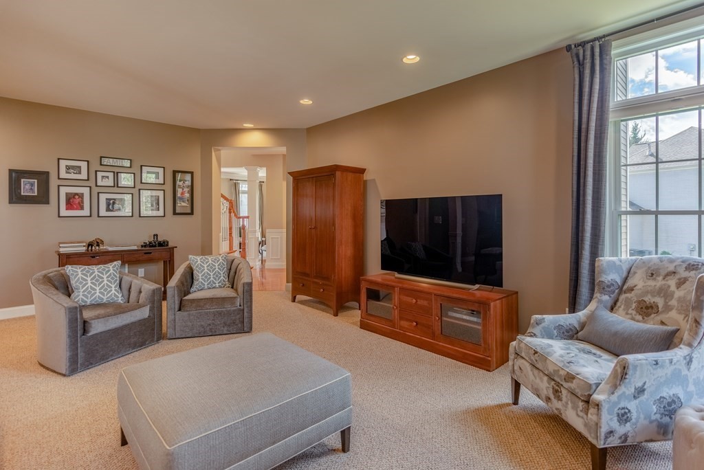 74 Canterbury Hill Road Acton, MA 01720 - Photo 17 of 37 a living room with furniture and a flat screen tv