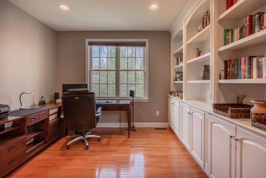 74 Canterbury Hill Road Acton, MA 01720 - Photo 18 of 37 a view of a workspace with furniture and a window