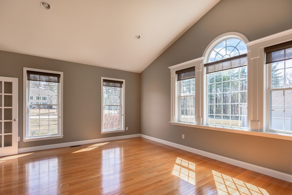 74 Canterbury Hill Road Acton, MA 01720 - Photo 19 of 37 a view of an empty room with wooden floor and a window