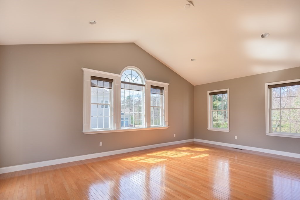 74 Canterbury Hill Road Acton, MA 01720 - Photo 20 of 37 an empty room with wooden floor and windows