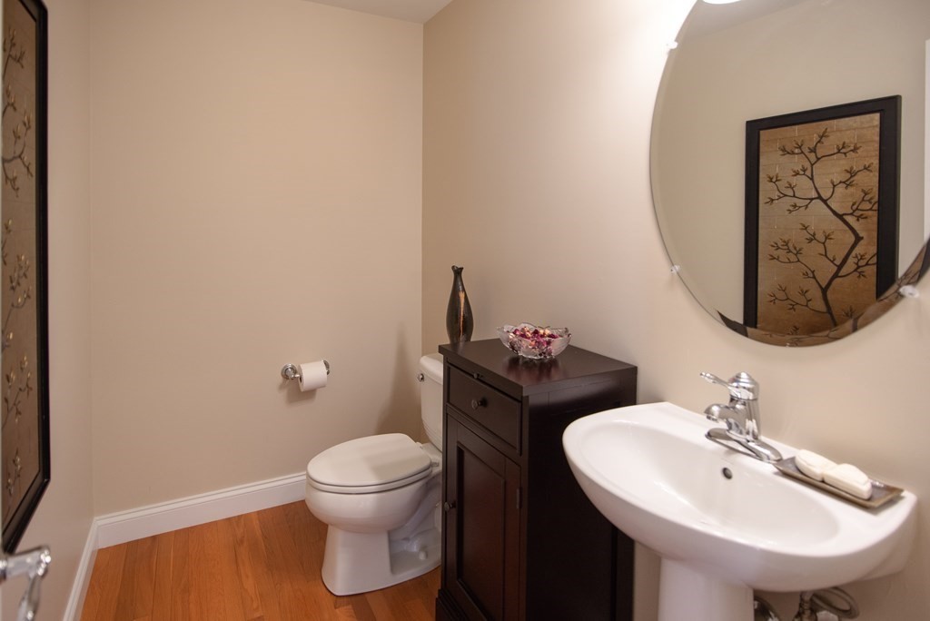 74 Canterbury Hill Road Acton, MA 01720 - Photo 21 of 37 a bathroom with a toilet sink and mirror