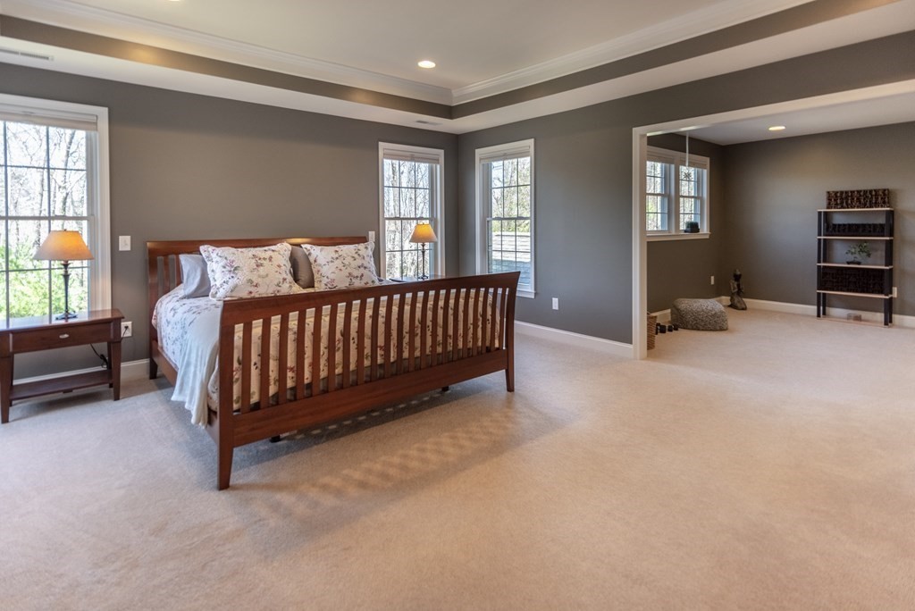 74 Canterbury Hill Road Acton, MA 01720 - Photo 23 of 37 a spacious bedroom with a bed and window
