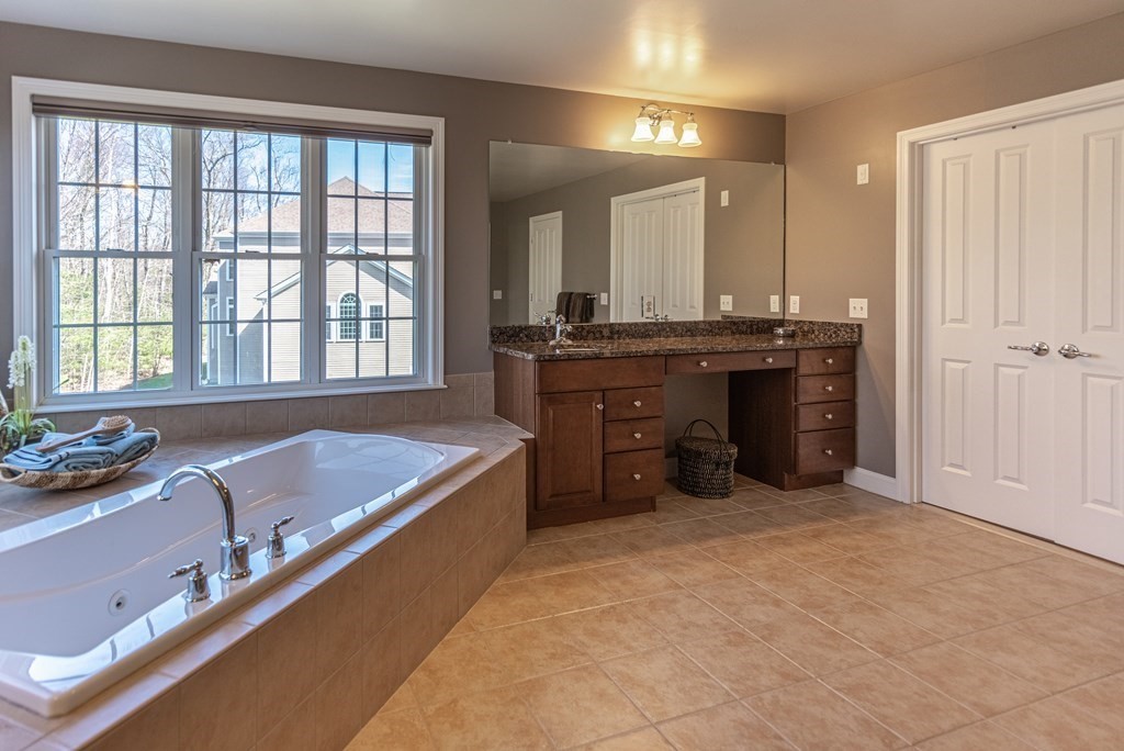 74 Canterbury Hill Road Acton, MA 01720 - Photo 27 of 37 a large spacious bathroom with a large tub and sink