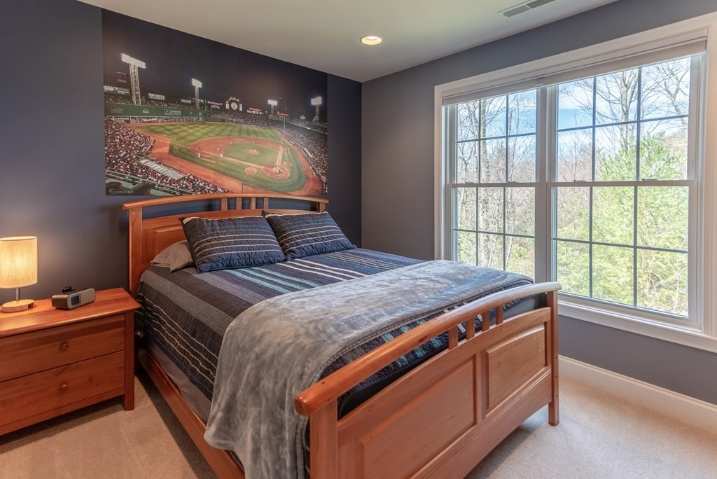 74 Canterbury Hill Road Acton, MA 01720 - Photo 32 of 37 a bedroom with a bed and a window