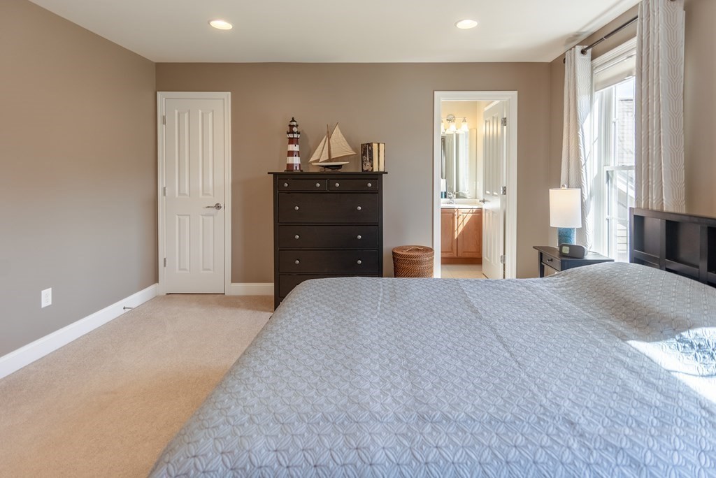 74 Canterbury Hill Road Acton, MA 01720 - Photo 34 of 37 a bedroom with a bed and a dresser