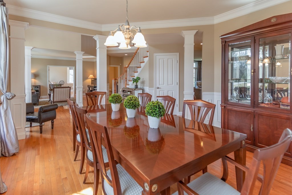 74 Canterbury Hill Road Acton, MA 01720 - Photo 5 of 37 a view of a dining room with furniture wooden floor and chandelier