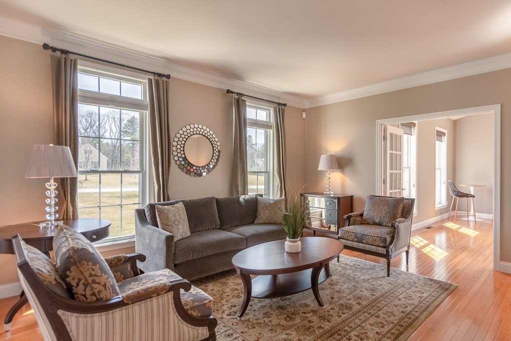 74 Canterbury Hill Road Acton, MA 01720 - Photo 7 of 37 a living room with furniture and a large window