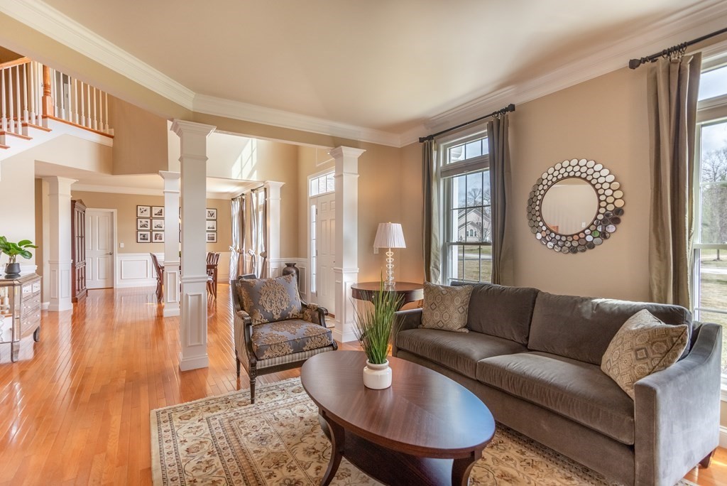 74 Canterbury Hill Road Acton, MA 01720 - Photo 8 of 37 a living room with furniture and a large window